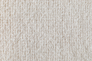 White neutral knitting fabric texture as background.