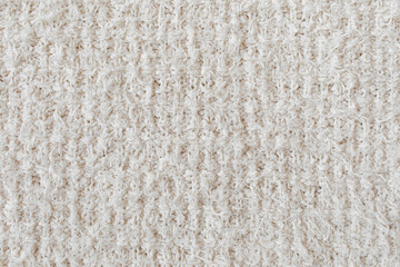 White neutral knitting fabric texture as background.