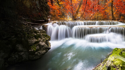 Amazing in nature, beautiful waterfall at colorful autumn forest in fall season	