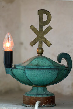 Pontigny Abbey church. Tabernacle lamp and Chi Rho christianity cross symbol. Pontigny. France.