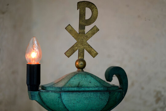Pontigny Abbey church. Tabernacle lamp and Chi Rho christianity cross symbol. Pontigny. France.