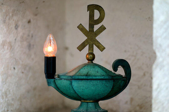Pontigny Abbey church. Tabernacle lamp and Chi Rho christianity cross symbol. Pontigny. France.