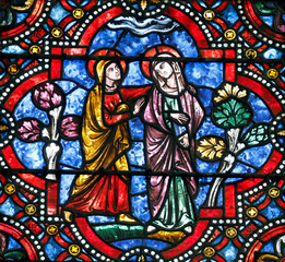 Fototapeta premium Auxerre cathedral. Stained glass. The Visitation of the Virgin is the visit of Mary with Elizabeth as recorded in the Gospel of Luke. Auxerre. France.