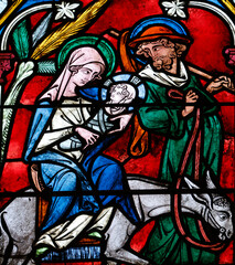 Fototapeta premium Auxerre cathedral. Stained glass. The Flight into Egypt. Holy Family. Auxerre. France.