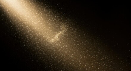Radiant light beam cascades down through a dark space, dust particles suspended in light