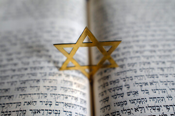Fototapeta premium Judaism. The Bible in Hebrew with a star of David.