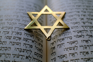 Fototapeta premium Judaism. The Bible in Hebrew with a star of David.