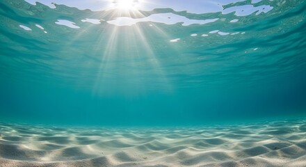 Sunlight Streaming Through Clear Ocean Water Onto Sandy Seabed