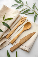 Bamboo cutlery set on a linen towel