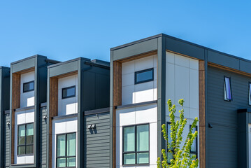 Top of modern apartment building with nice windows in Summer in Vancouver, Canada, North America. Day time on May 2025.