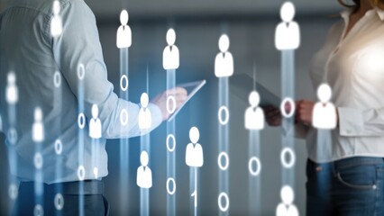 Two people discuss digital recruitment, surrounded by virtual human icons and data, symbolizing HR and technology integration.