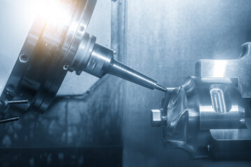 The 5-axis CNC milling machine multi-tasking type finish cutting the automotive part with solid...