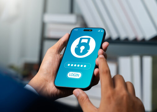 Businessman using smartphone to encrypt and protect sensitive company and personal data. Cybersecurity technology help prevent hacker attack, ensuring data privacy and secure digital communication.