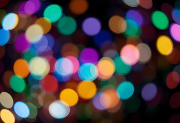 Fototapeta premium Abstract festive background with colorful, glowing, and blurred holiday lights