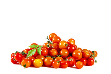 Pile of fresh shiny cherry tomatoes. Isolated on white.