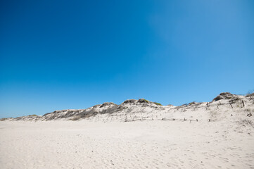 Sand dunes landscape under a summer blue sky