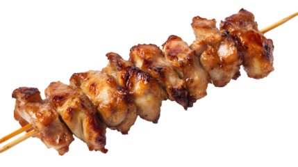 A skewer of chicken is sitting on a white background. The chicken is cooked and has a golden brown color