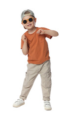 Happy little boy with sunglasses dancing on white background