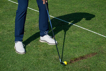 Golfer preparing to swing at the driving range