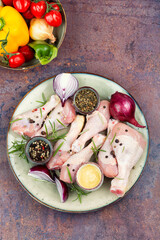 Uncooked raw chicken legs.