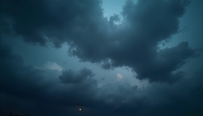 Moody dark clouds covering the sky with a hint of light