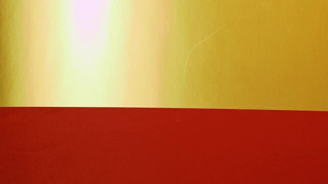 Vivid construction paper backgrounds in bold colors are gently animated by soft, natural shadows gliding across the surface, creating depth, movement, and visual warmth.