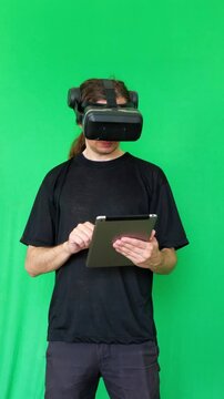 This footage conveys an innovative and technologically advanced mood, ideal for showcasing the integration of virtual reality with other digital devices, perfect for tech demonstrations
