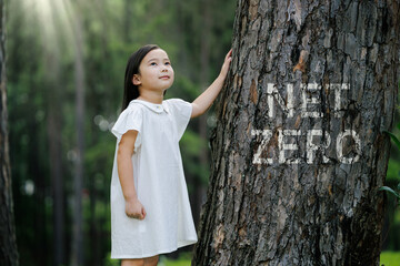 Child in Forest with Net Zero Message on Tree