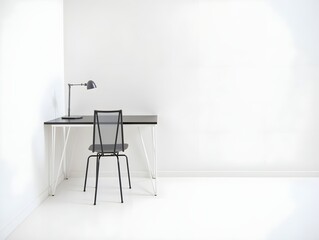 A black chair and table in a white room