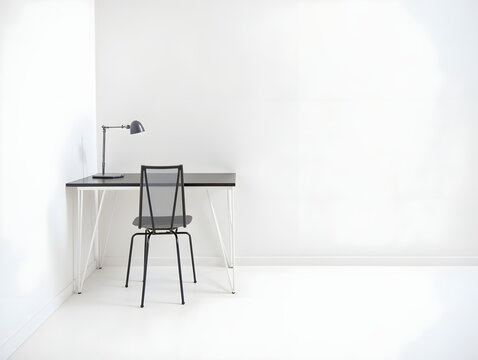 A black chair and table in a white room
