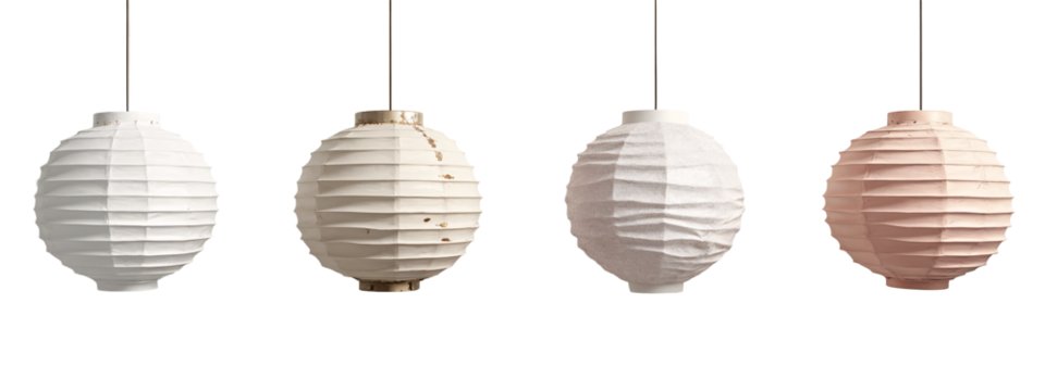 A set of four white and pink paper lanterns hanging from a string.