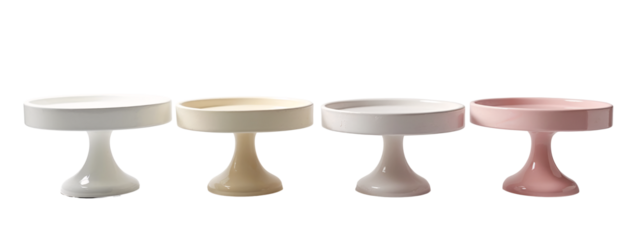 A set of three white and pink cake stands