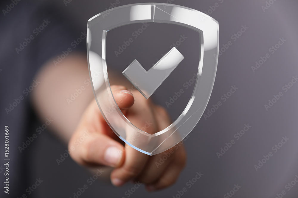 Poster Hand pointing at a transparent shield with a checkmark.  Cybersecurity, data protection, and safety concept.