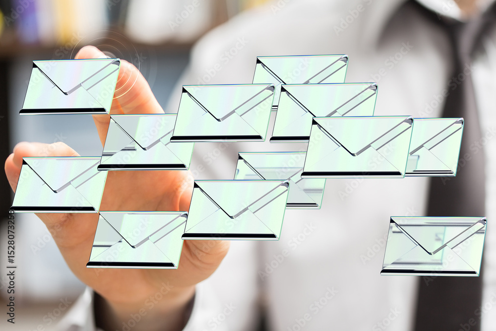 Aufkleber efficiently handle email overload. stock photo of a person managing many emails.