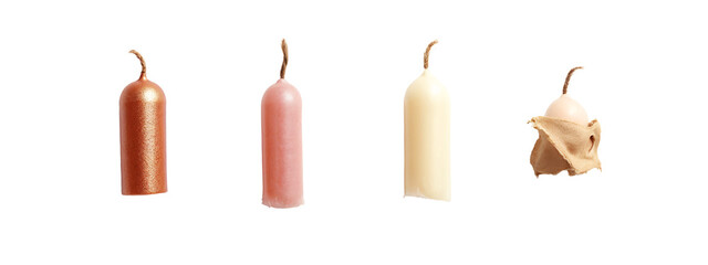 A group of three different colored candles