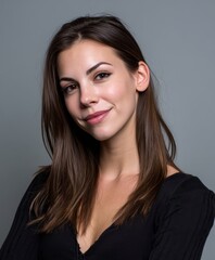 Obraz premium A woman with long brown hair and a black shirt