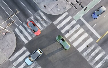 Top-view render of smart vehicles approaching an intersection. Zoom-in shot. - Powered by Adobe
