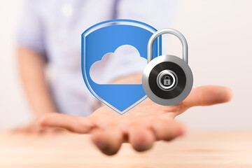 Image depicts secure cloud data protection.  A digital lock and shield are shown on an outstretched...