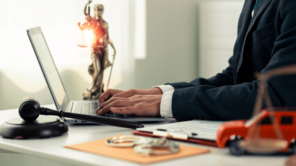 Justice court judge using hammer and red toy car. Traffic and driving law concept. Car accident. Drunk driving legal case. Close up. © MrAshi