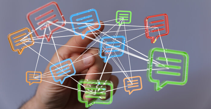 Hand interacts with a network of digital message bubbles, symbolizing global communication and interconnectedness. - Powered by Adobe