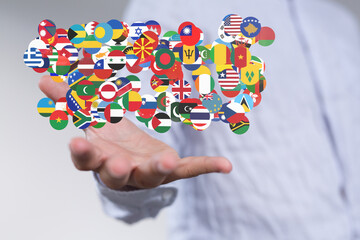 Hand holding diverse flags. Global business, international cooperation, world map concept.
