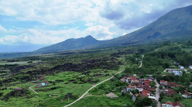 West Java, Indonesia - April 8, 2025: Aerial view drone shot of Mount Guntur and village in Garut