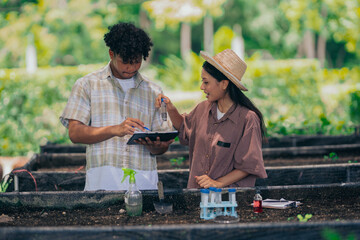  Group of young people learning about farming, farming, and cultivation in a greenhouse.
