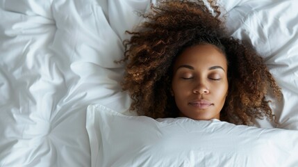 A woman with curly hair peacefully sleeps in white bedding, emanating tranquility and comfort, highlighting the importance of rest and self-care in daily life.