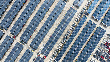 Aerial top view of car park with solar panel photovoltaic, Solar panel photovoltaic installation on roof of car parking lot, Alternative electricity source sustainable resources.