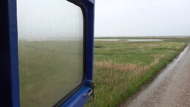 Mando, Denmark The view from a bus traversing the tidal plains to Mando Island over North Sea marshes. 