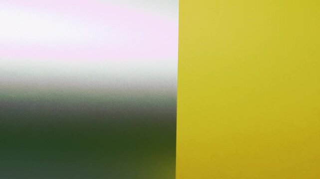Vivid construction paper backgrounds in bold colors are gently animated by soft, natural shadows gliding across the surface, creating depth, movement, and visual warmth.