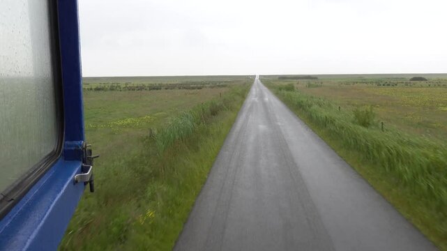 Mando, Denmark The view from a bus traversing the tidal plains to Mando Island over North Sea marshes. 