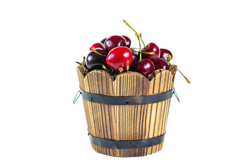 Ripe juicy cherries in a wooden bucket isolated on white background.