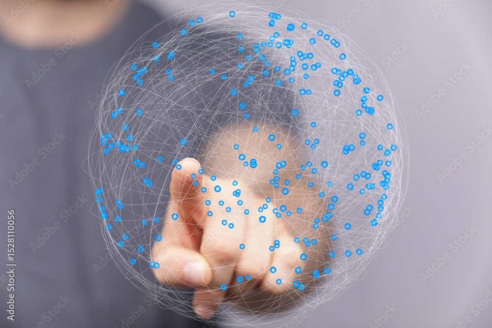 Fototapete Abstract image of a hand interacting with a digital sphere representing global network connections.